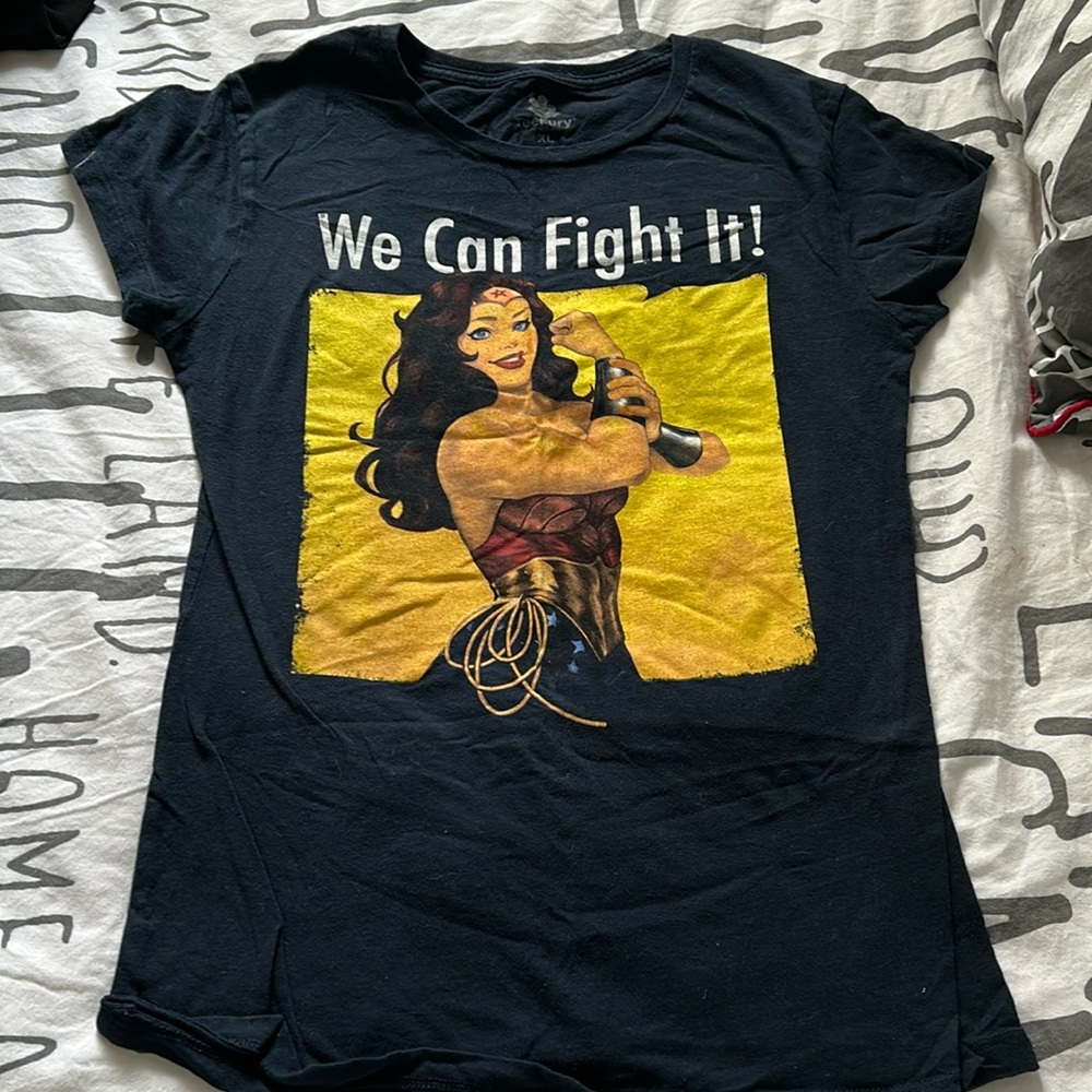 Rosie the riveter style- “we can fight it” Wonder Woman